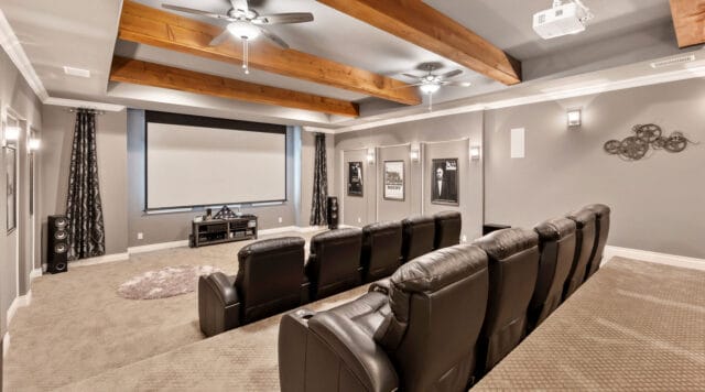 view of large theater room with seating and projector screen